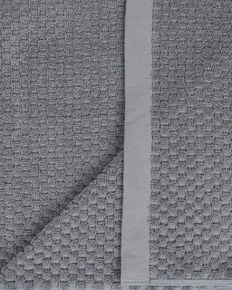 Close-up of gray textured fabric with a subtle pattern