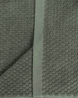 Textured fabric with a subtle pattern on a plain background