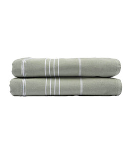 Two green towels with white stripes stacked on a white background