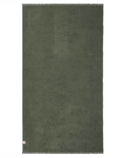 Solid green towel on a white background