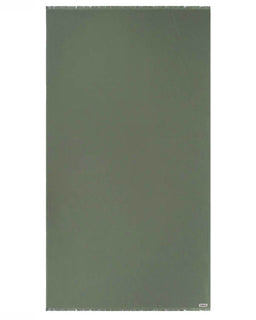 Solid green towel on a white background
