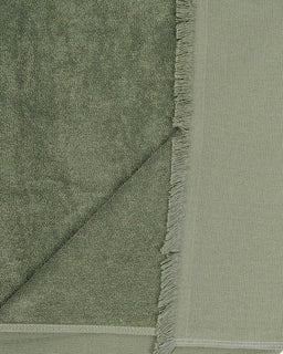 Green fabric with fringe edge