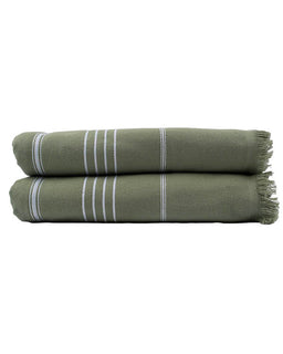 Two green towels with white stripes stacked on a white background