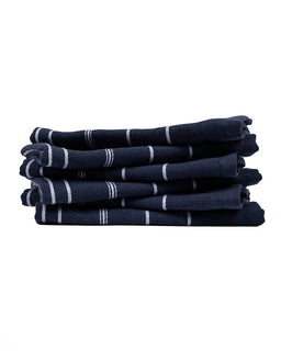 Stack of navy blue striped towels on a white background
