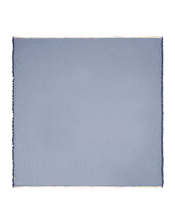 Light blue woven blanket on a white background