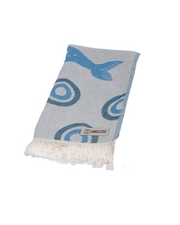 Gray towel with blue whale patterns and white fringe on a white background