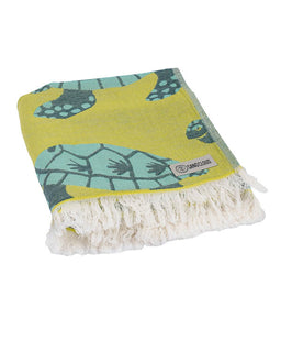 Beach towel with turtle pattern and brand logo on a white background