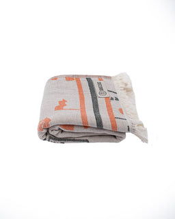 Folded blanket with geometric pattern on a white background
