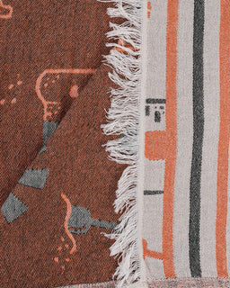 Textile with geometric pattern and fringed edge