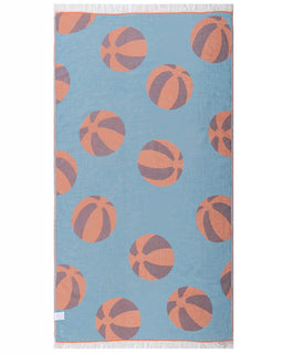 Towel with beach ball pattern on a blue background
