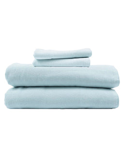 Stack of light blue towels on a white background