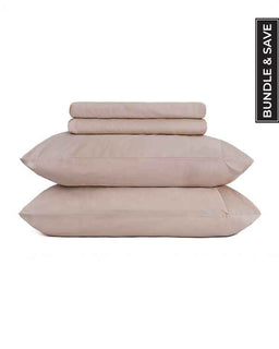 Set of pink bedding including a duvet, two pillows, and a fitted sheet on a white background.
