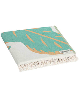 Folded view of Beach towel with tropical leaves design on a white background