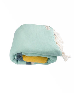 Folded towel with colorful layers on a white background