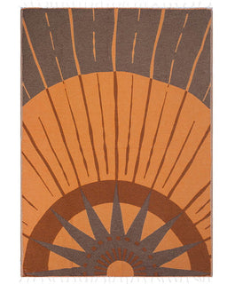 Blanket with sunburst pattern in brown and orange on a white background