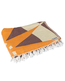 Geometric patterned towel with orange, brown, and beige colors on a white background