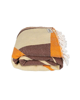 Folded blanket with orange, brown, and beige stripes on a white background