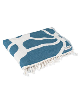 Blue and white patterned towel with tassels on a white background