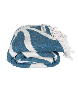 Blue and white patterned towel with tassels on a white background