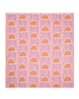 Pink and orange patterned blanket with geometric design