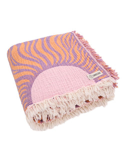 Blanket with wavy pattern and fringe on a white background