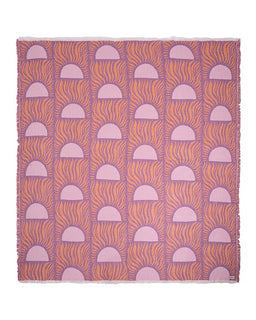 Patterned blanket with pink and orange design on a white background