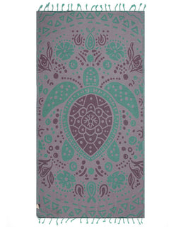 Patterned towel with turtle design on a white background