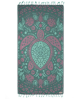 Decorative towel with turtle design in teal and pink on a white background