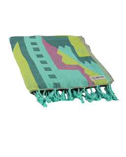 Colorful patterned towel with tassels on a white background
