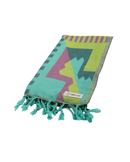 Colorful towel with geometric pattern and tassels on a white background