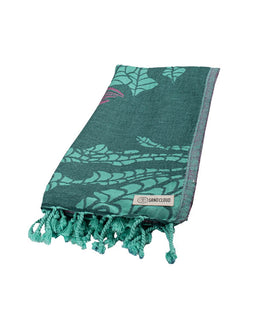 Green patterned towel with tassels on a white background