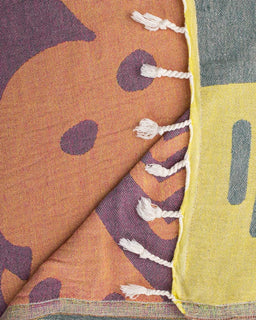 Close-up of fabric with a pattern and a yellow border