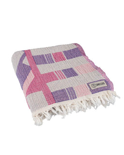 Checkered towel with purple and pink squares on a white background