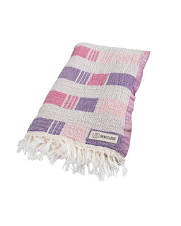 Checkered towel with fringes and a brand logo on a white background