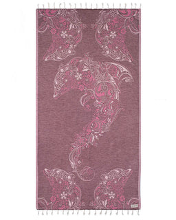 Towel with dolphin and paisley pattern on a white background