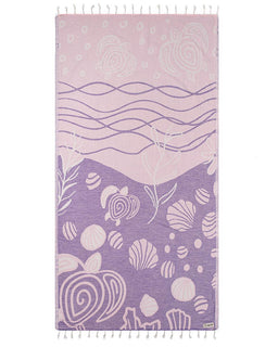 Towel with ocean-themed design featuring waves and sea creatures on a white background