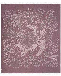 Decorative towel with turtle and sea creature design on a purple background