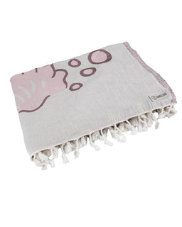 Gray towel with pink abstract design and white tassels on a white background