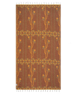 Decorative towel with a brown and orange pattern on a white background