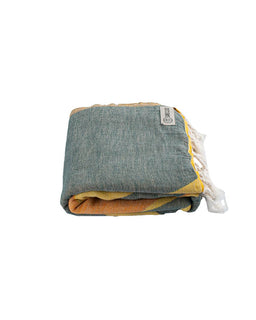 Folded towel with a label on a white background