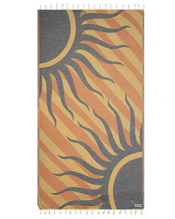 Towel with sun design in orange, yellow, and gray on a white background