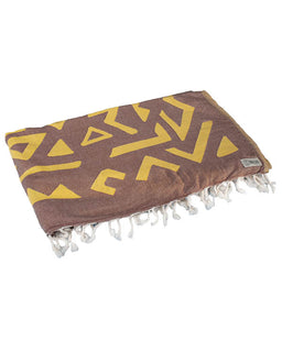 Brown towel with yellow geometric pattern and white fringe on a white background