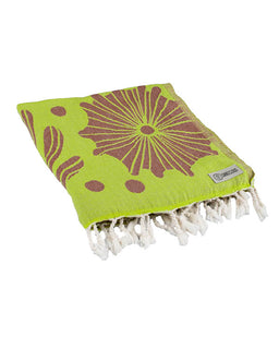 Green towel with brown floral pattern and white tassels on a white background