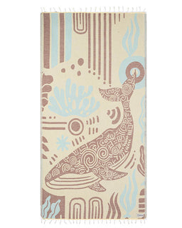 Beige towel with whale design and abstract patterns on a white background