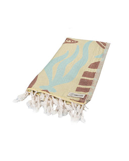 Towel with sea-themed design and tassels on a white background