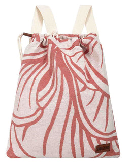 A drawstring backpack made of textured canvas fabric with a coral pink and white abstract leaf pattern, featuring cream-colored shoulder straps and a small brown leather brand patch on the bottom right.