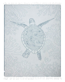 Towel with turtle design on a light gray background