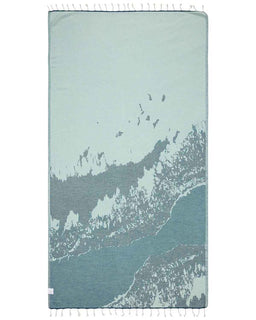 Teal and gray patterned towel with white tassels on a white background