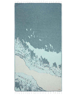 Towel with abstract design of water and beach on a white background
