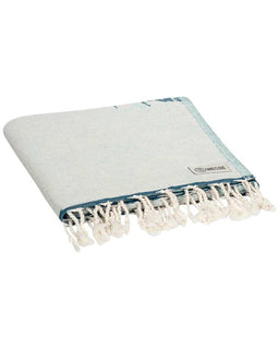 Light blue towel with white tassels on a white background